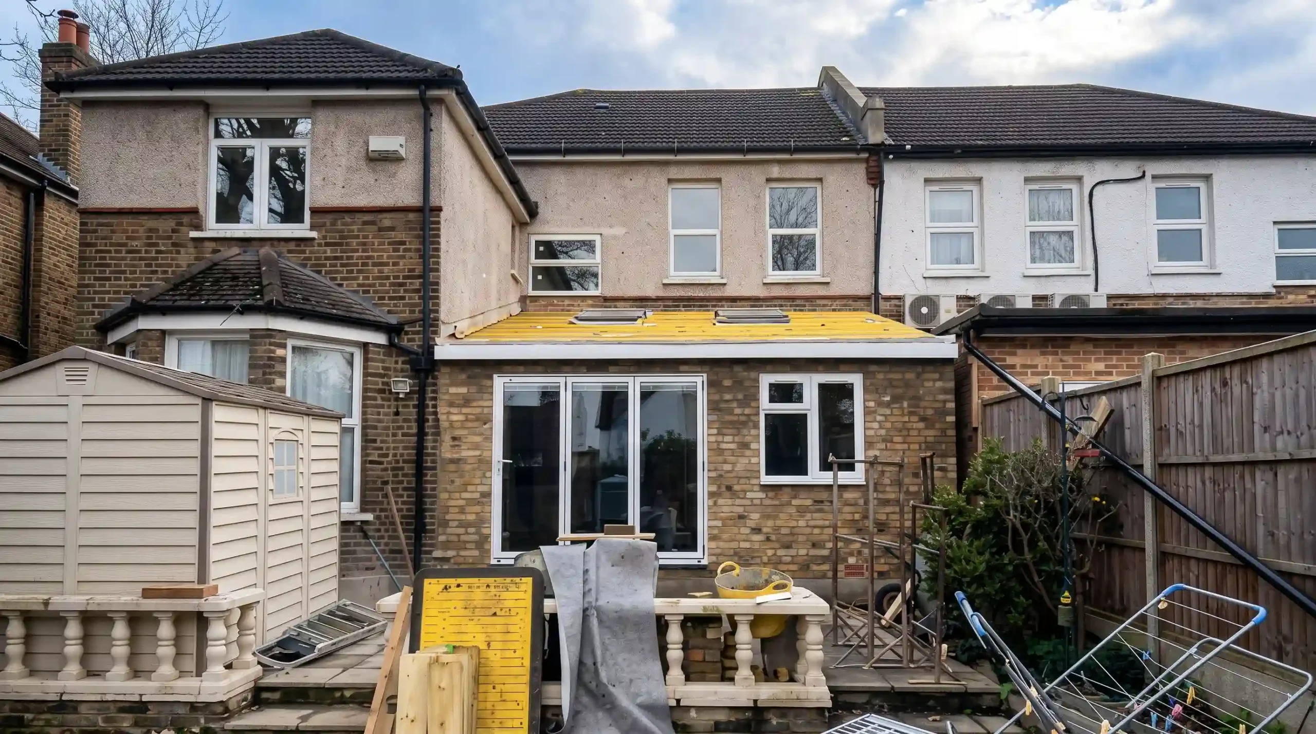 Modern rear house extension with bi-fold doors opening onto the garden